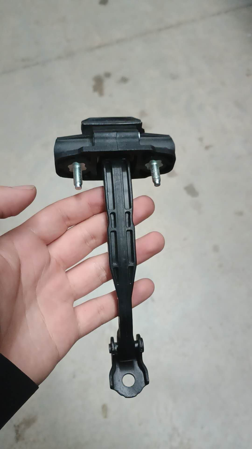 Behind Tesla MY door stopper