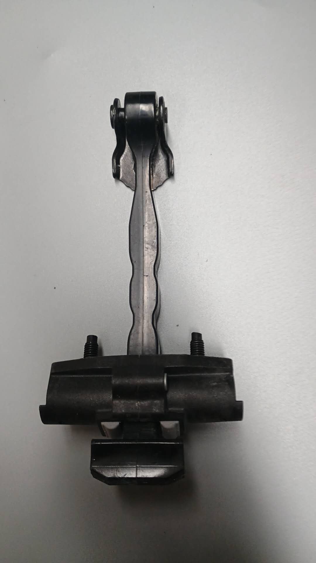 Behind Tesla M3 door stopper