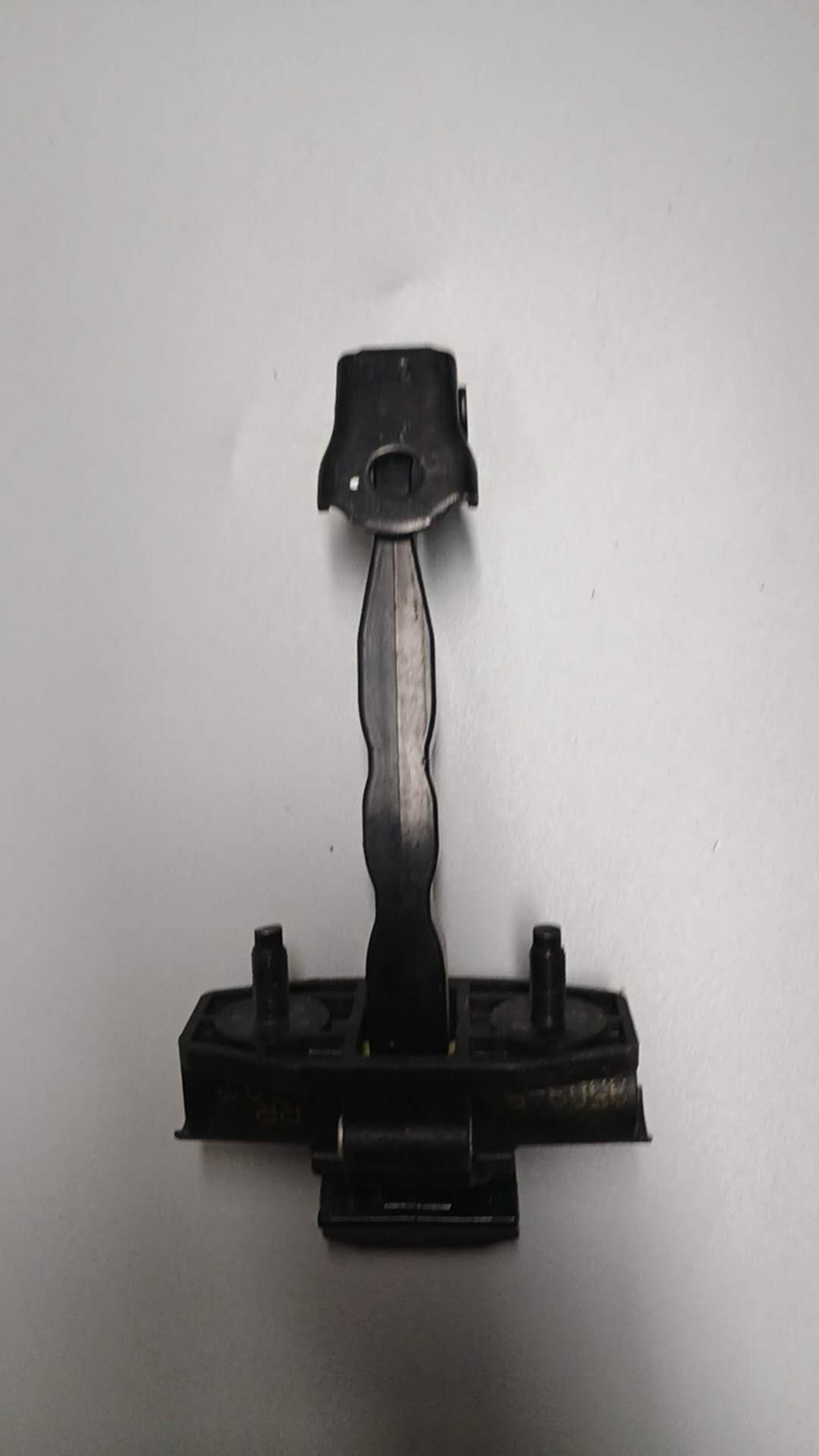 Behind Tesla M3 door stopper